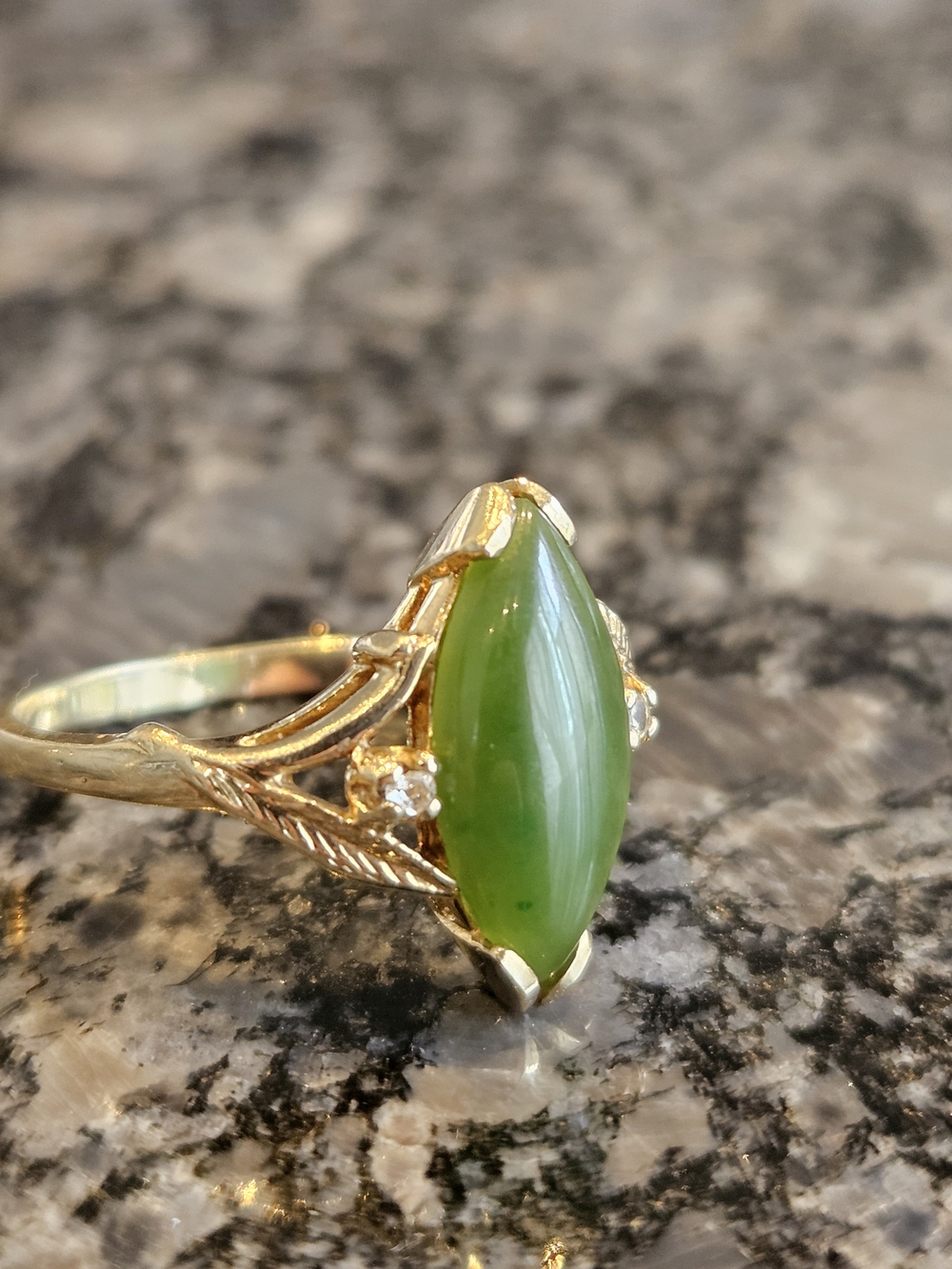 Gold Ring with Green Marquise Stone and Accent Diamonds